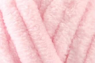 Plush baby pink chenille toddler blanket, hand-knitted for softness and comfort—ideal for little girls’ rooms or toddler naps.