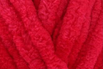 Bright cherry pink chenille toddler blanket, hand-knitted for a vibrant, cosy touch—great for toddler girls' rooms or bold baby gifts.