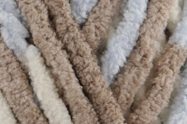 Close-up of ultra-soft chenille yarn in brown, blue and white tones – Cosmos Snuggle Square baby comforter by SnugaBug
