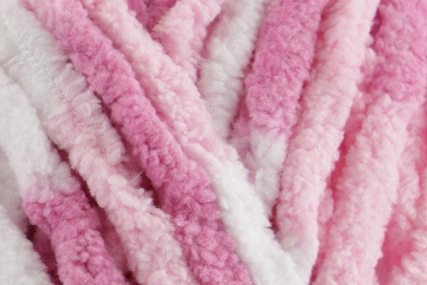 Close-up of ultra-soft chenille yarn in soft pink and cream tones – Strawberry Milkshake Snuggle Square baby comforter by SnugaBug