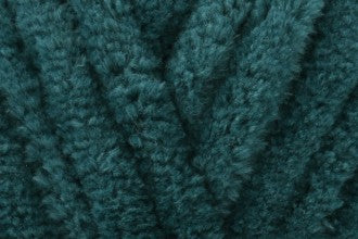 Close-up of soft dark forest green chenille yarn texture used in hand-knitted baby comforters by SnugaBug